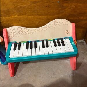 Batatt wooden toy piano and dog guitar